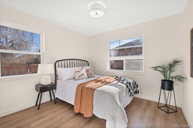 bedroom with light hardwood / wood-style flooring