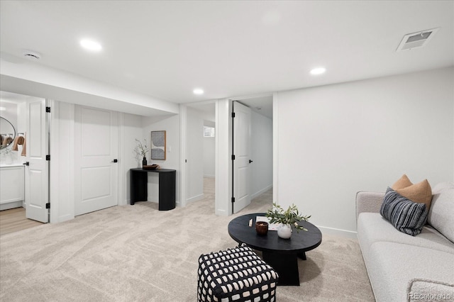 living room with light colored carpet