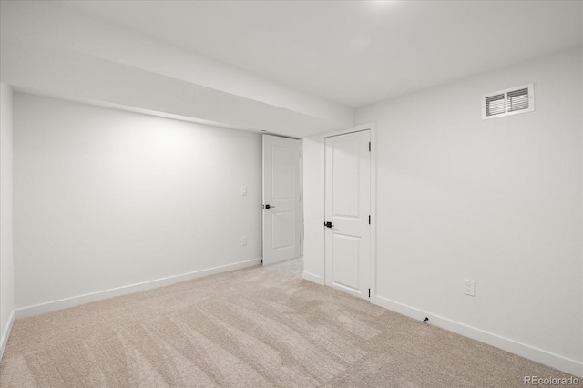 empty room with light colored carpet