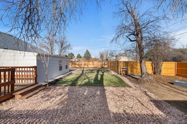 view of yard with a wooden deck