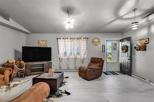 3569 County Road 19, Florence, CO 81226 - living area featuring a baseboard radiator, lofted ceiling, and ceiling fan