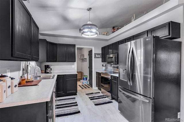3569 County Road 19, Florence, CO 81226 - kitchen with appliances with stainless steel finishes, a sink, light countertops, a chandelier, and dark cabinetry