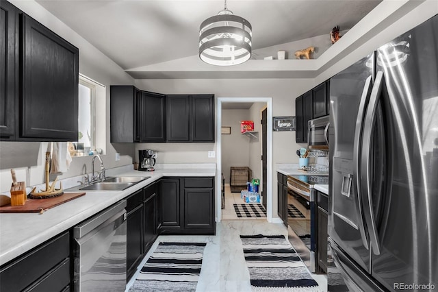 3569 County Road 19, Florence, CO 81226 - kitchen featuring appliances with stainless steel finishes, a sink, light countertops, dark cabinets, and lofted ceiling
