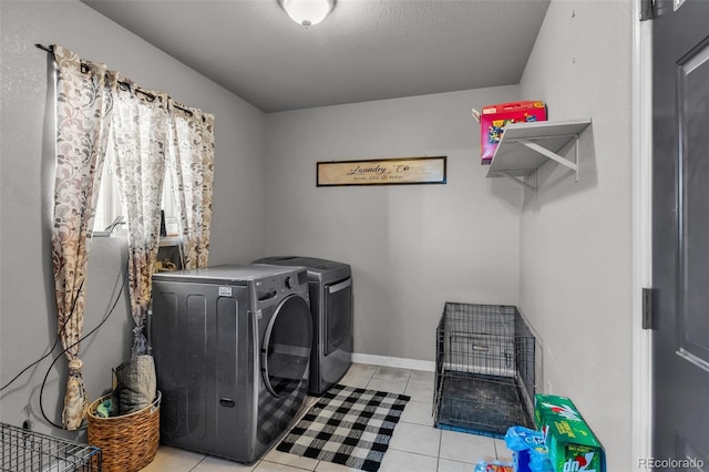 3569 County Road 19, Florence, CO 81226 - clothes washing area featuring independent washer and dryer and tile patterned flooring
