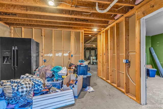 3569 County Road 19, Florence, CO 81226 - unfinished basement with black refrigerator with ice dispenser