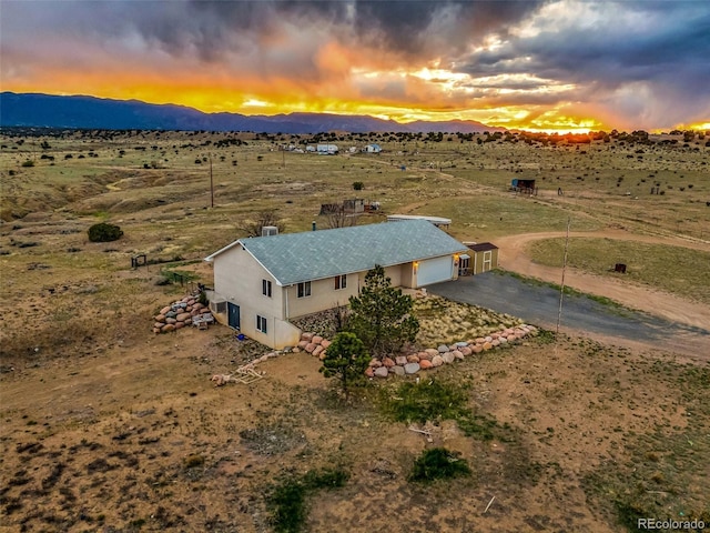3569 County Road 19, Florence, CO 81226 - aerial view at dusk of a mountain view and a view of rural / pastoral area