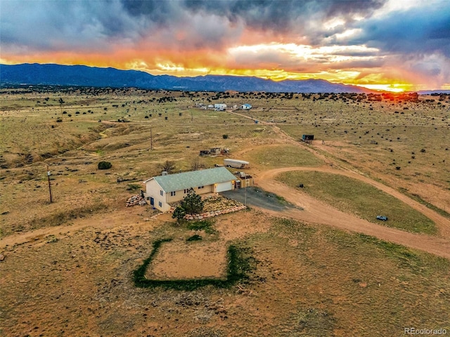 3569 County Road 19, Florence, CO 81226 - aerial view at dusk of a mountain view and a view of countryside