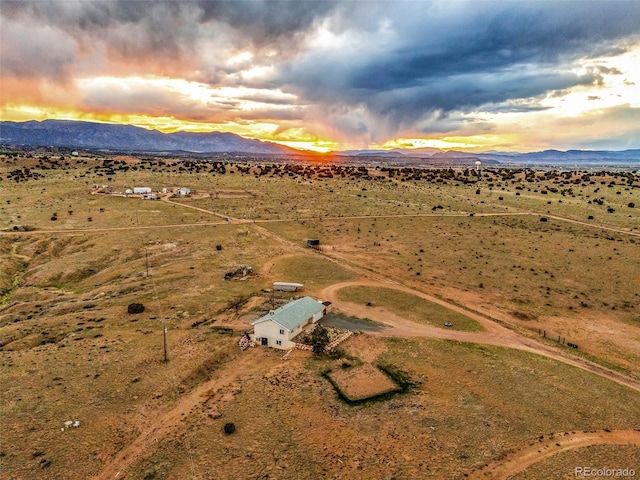 3569 County Road 19, Florence, CO 81226 - aerial view at dusk of a mountain view, a view of countryside, and a desert view