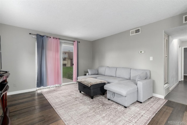10211 Ura Ln Unit 8-102, Thornton, CO 80260 - living room with wood finished floors and a textured ceiling