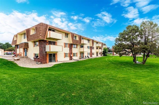 10211 Ura Ln Unit 8-102, Thornton, CO 80260 - view of property's community featuring a lawn