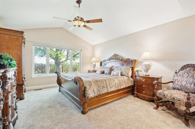 bedroom with light colored carpet, visible vents, a ceiling fan, baseboards, and vaulted ceiling