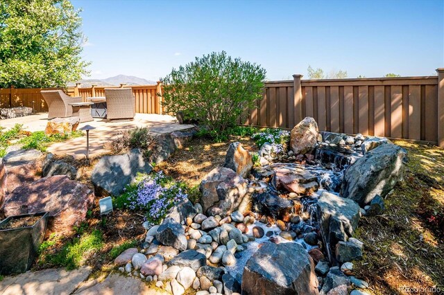 view of yard with a patio and fence