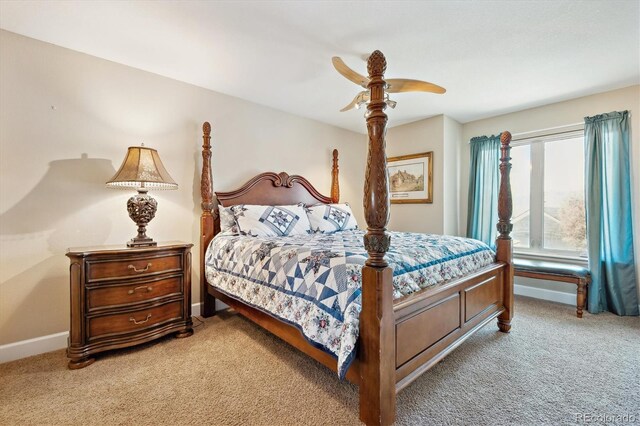 bedroom featuring baseboards, light carpet, and ceiling fan
