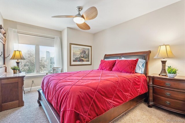 bedroom featuring baseboards, carpet flooring, and a ceiling fan