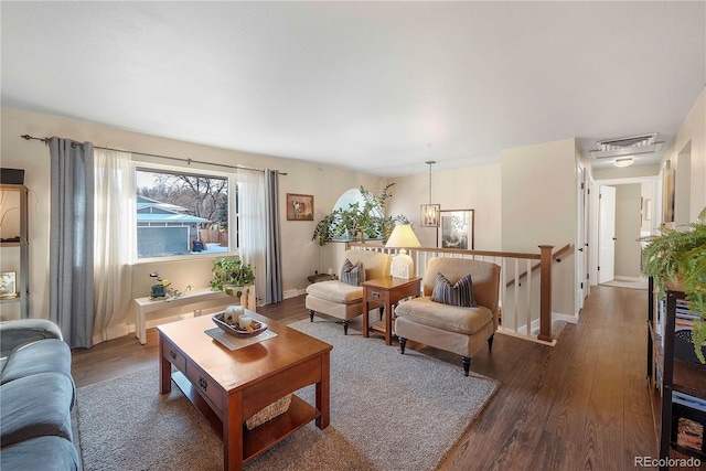 living room featuring dark wood-type flooring