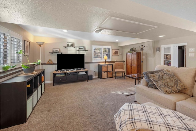 living room with light carpet and a textured ceiling