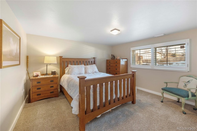 bedroom featuring light carpet