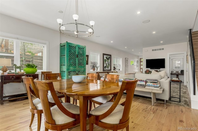3168 W 29th Ave, Denver, CO 80211 - dining area with a chandelier, light wood finished floors, and recessed lighting