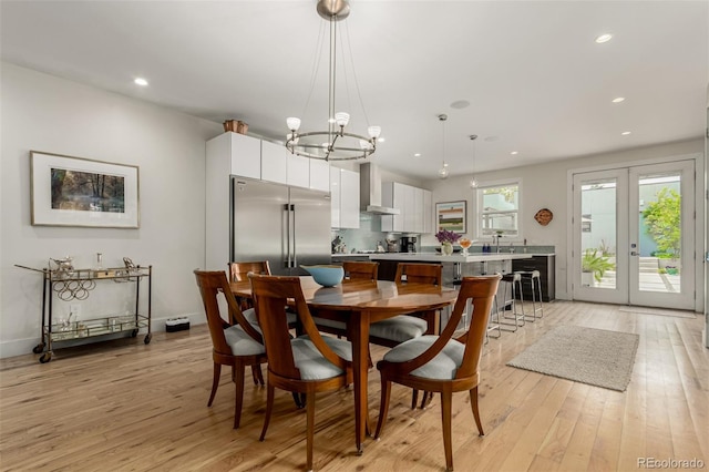 3168 W 29th Ave, Denver, CO 80211 - dining room featuring light wood-style flooring, recessed lighting, a chandelier, and baseboards