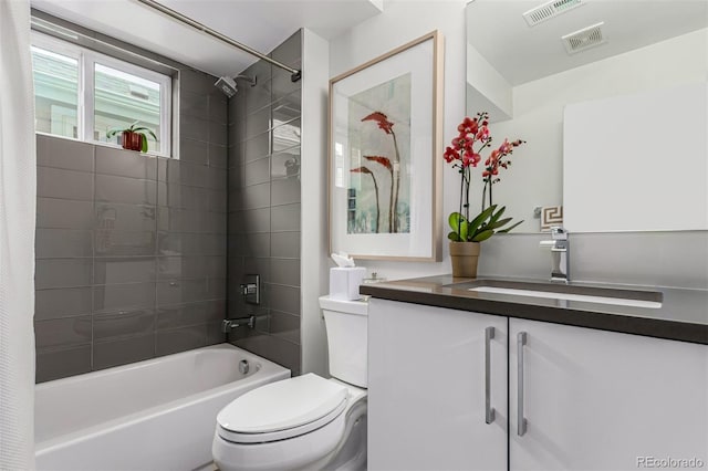 3168 W 29th Ave, Denver, CO 80211 - bathroom featuring toilet, shower / bath combo, and vanity