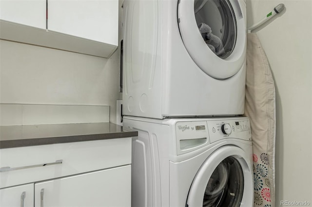 3168 W 29th Ave, Denver, CO 80211 - washroom with estacked washer and dryer and cabinet space