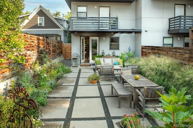 3168 W 29th Ave, Denver, CO 80211 - back of house with an outdoor hangout area, a balcony, a patio area, and stucco siding