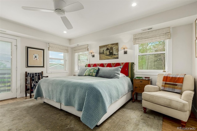 3168 W 29th Ave, Denver, CO 80211 - bedroom with wood finished floors, multiple windows, recessed lighting, ceiling fan, and access to exterior