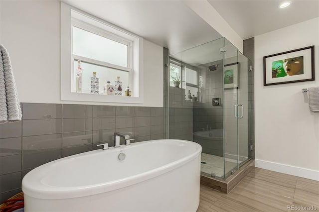 3168 W 29th Ave, Denver, CO 80211 - full bath with a freestanding tub, tile walls, a shower stall, and baseboards