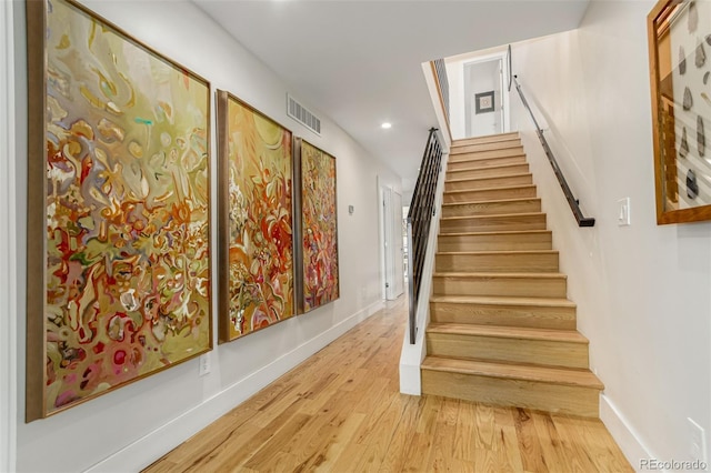 3168 W 29th Ave, Denver, CO 80211 - stairs with wood finished floors, baseboards, and recessed lighting