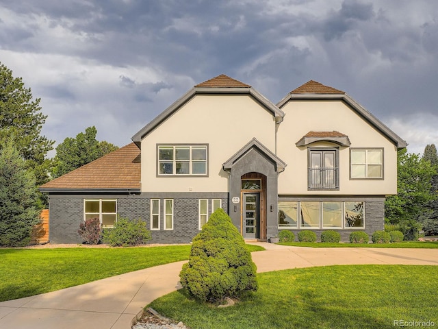 22 Rangeview Dr, Wheat Ridge, CO 80215 - view of front facade featuring a front yard and stucco siding
