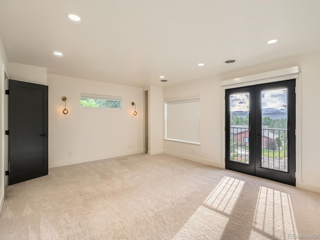 22 Rangeview Dr, Wheat Ridge, CO 80215 - spare room with french doors, light colored carpet, and recessed lighting