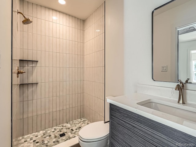 22 Rangeview Dr, Wheat Ridge, CO 80215 - bathroom with a tile shower, vanity, and recessed lighting