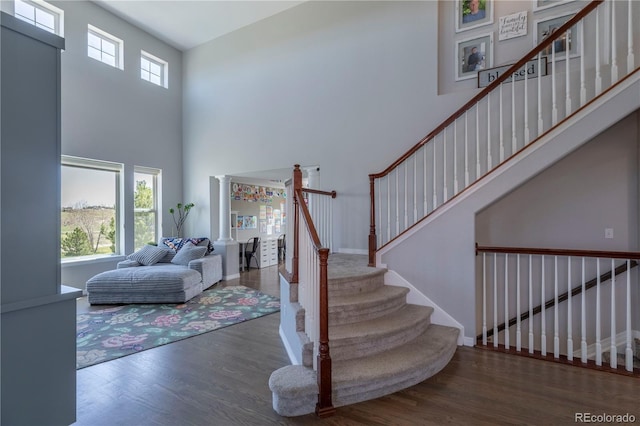 2339 Elkhorn St, Parker, CO 80138 - foyer entrance featuring wood finished floors, stairway, and a high ceiling
