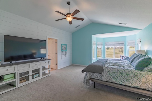 2339 Elkhorn St, Parker, CO 80138 - carpeted bedroom featuring lofted ceiling, wooden walls, and a ceiling fan