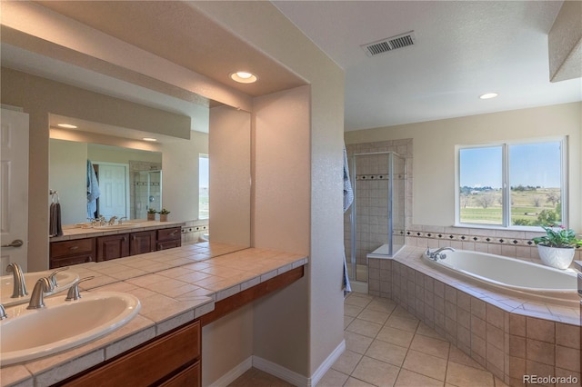 2339 Elkhorn St, Parker, CO 80138 - full bath featuring tile patterned flooring, a shower stall, a bath, vanity, and recessed lighting
