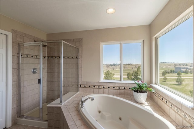 2339 Elkhorn St, Parker, CO 80138 - full bathroom with a shower stall, plenty of natural light, a jetted tub, and recessed lighting