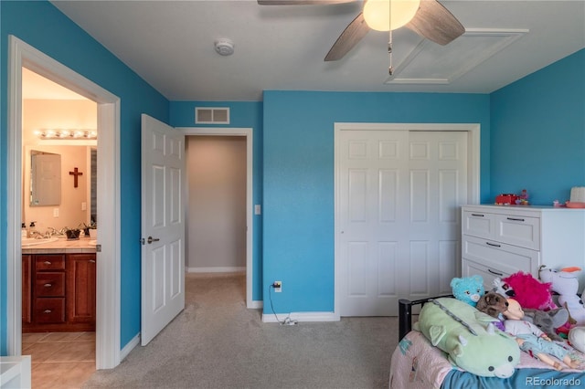 2339 Elkhorn St, Parker, CO 80138 - bedroom featuring a closet, baseboards, ceiling fan, connected bathroom, and light carpet