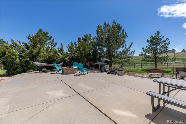 2339 Elkhorn St, Parker, CO 80138 - view of patio featuring a fire pit and fence