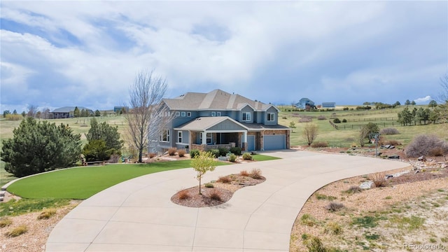 2339 Elkhorn St, Parker, CO 80138 - view of front of house with curved driveway, a porch, a front lawn, and an attached garage
