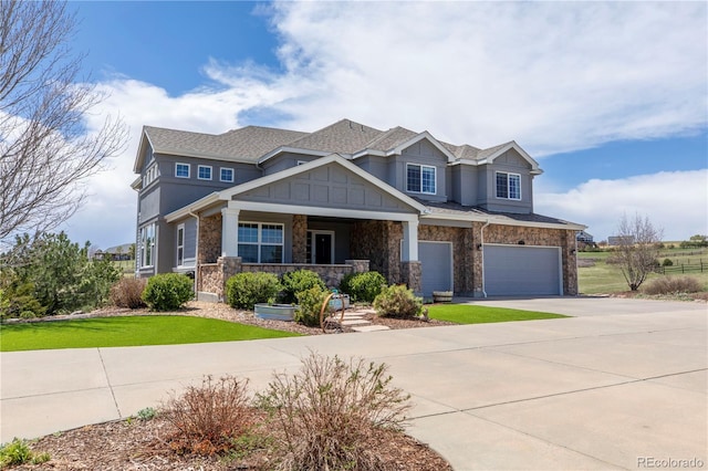 2339 Elkhorn St, Parker, CO 80138 - craftsman-style home featuring a garage, driveway, covered porch, stone siding, and a front lawn