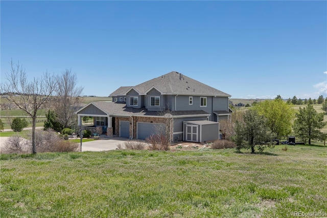 2339 Elkhorn St, Parker, CO 80138 - back of property featuring a shed, a garage, a yard, and an outbuilding