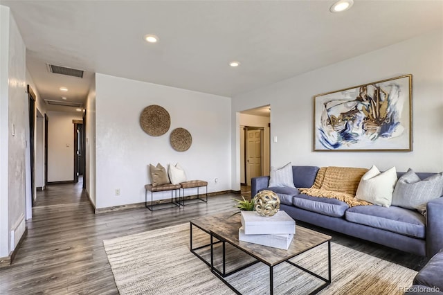 living room with dark hardwood / wood-style floors