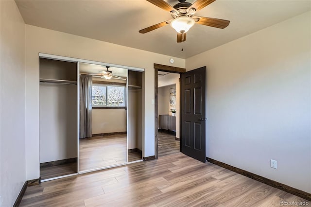 unfurnished bedroom featuring ceiling fan, wood-type flooring, and a closet