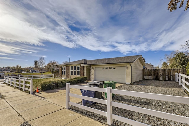 single story home with a garage