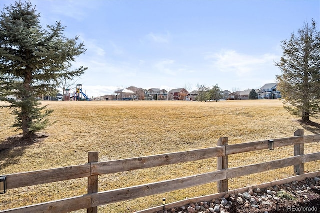 view of yard with a playground and fence