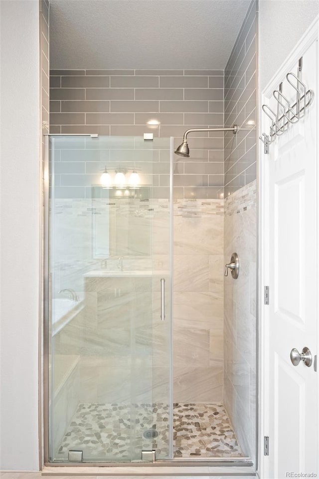 full bathroom with a stall shower