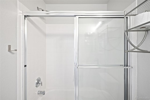 full bathroom featuring combined bath / shower with glass door