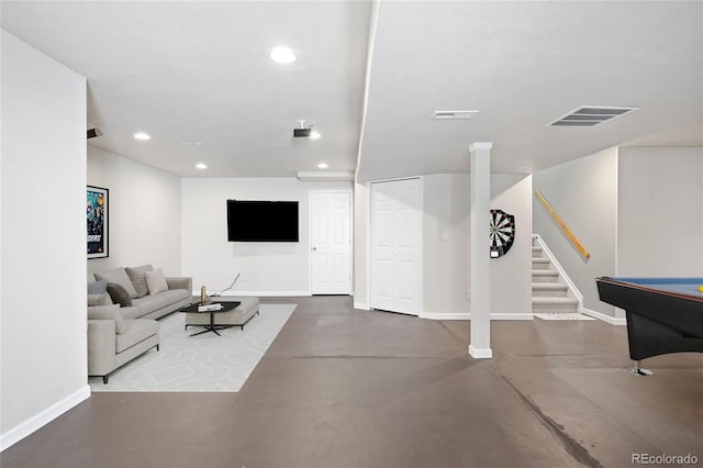 living room featuring stairs, concrete floors, visible vents, and recessed lighting