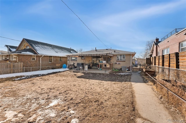 back of house featuring central AC unit and a patio