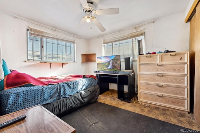 bedroom featuring multiple windows and ceiling fan